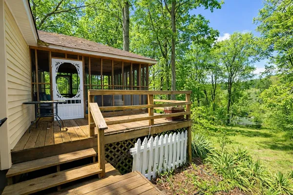 a view of a wooden deck with a bench