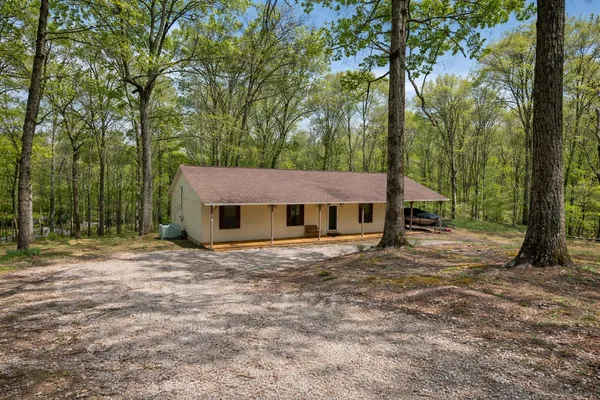 a house with trees in the background