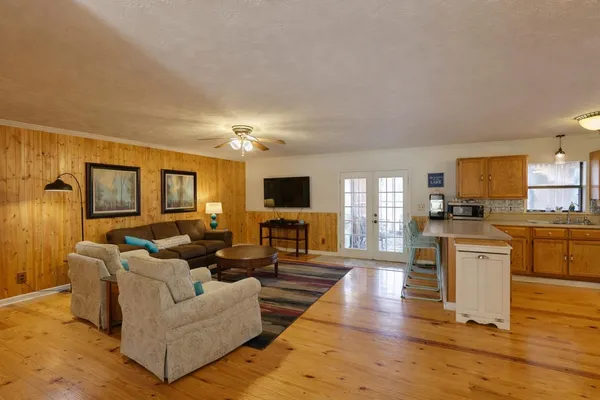 a living room with fireplace furniture and a flat screen tv