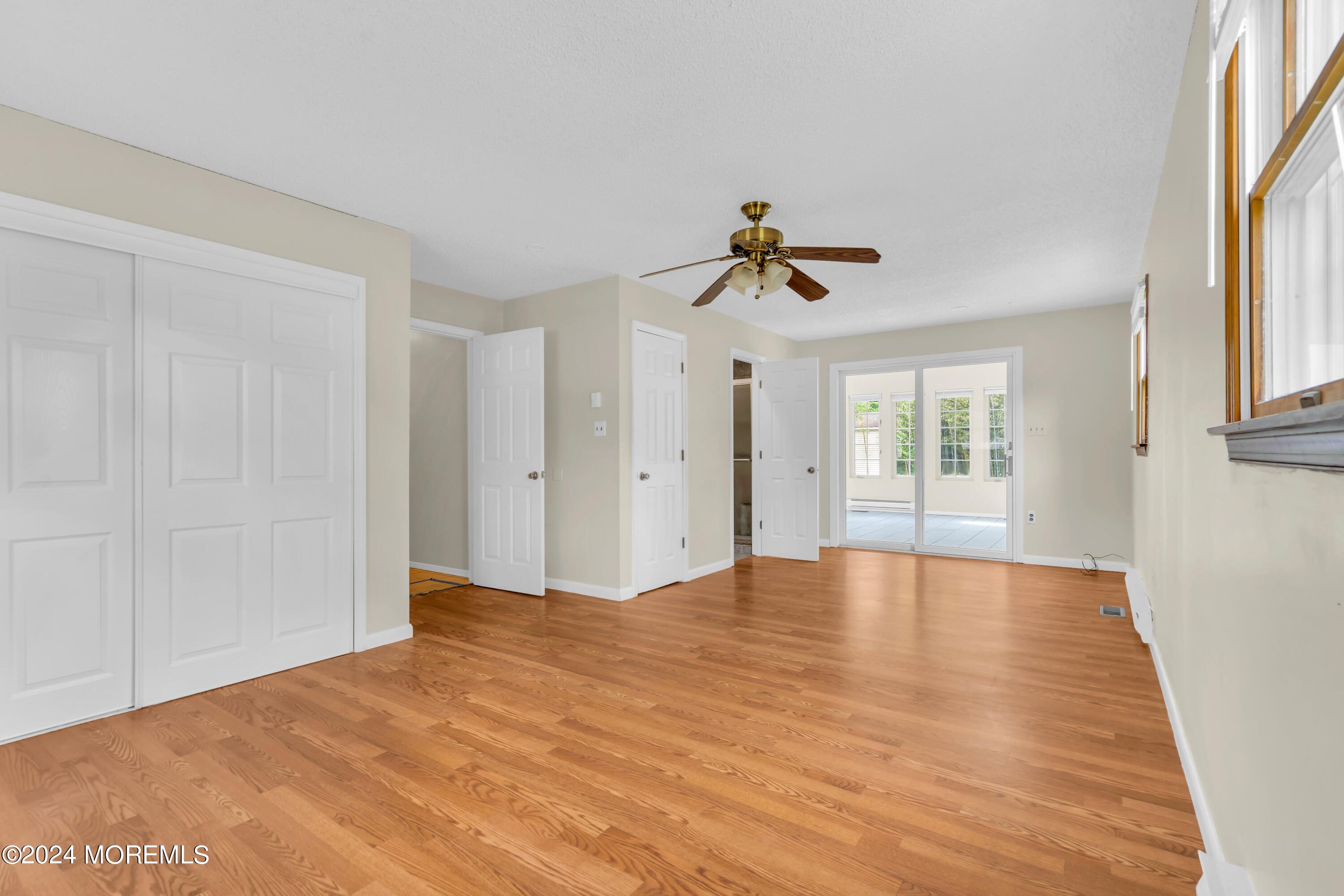108 Jericho Road Tuckerton, NJ 08087 - Photo 14 of 24 a view of empty room with windows and ceiling fan