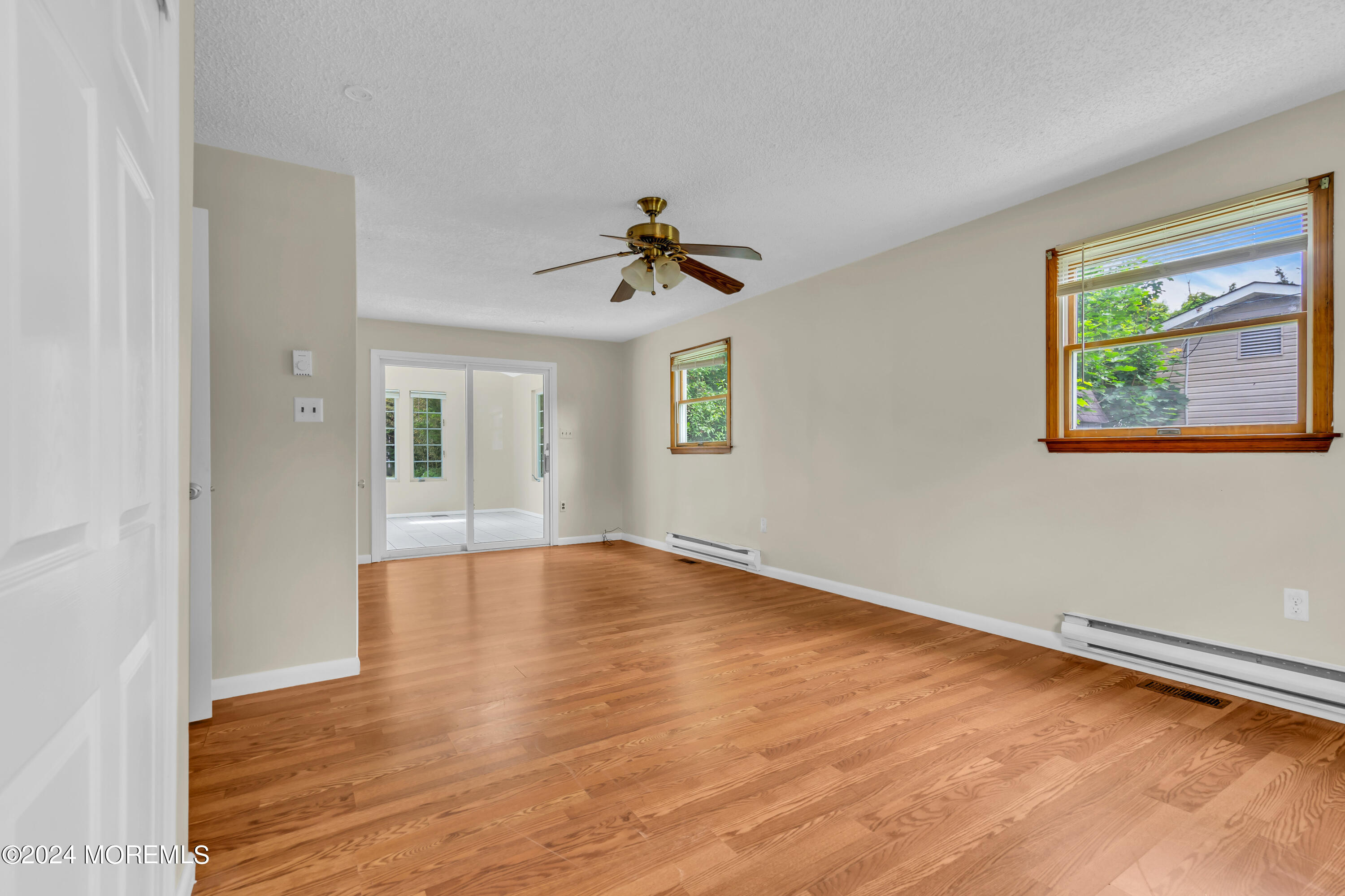108 Jericho Road Tuckerton, NJ 08087 - Photo 15 of 24 wooden floor in an empty room with a window