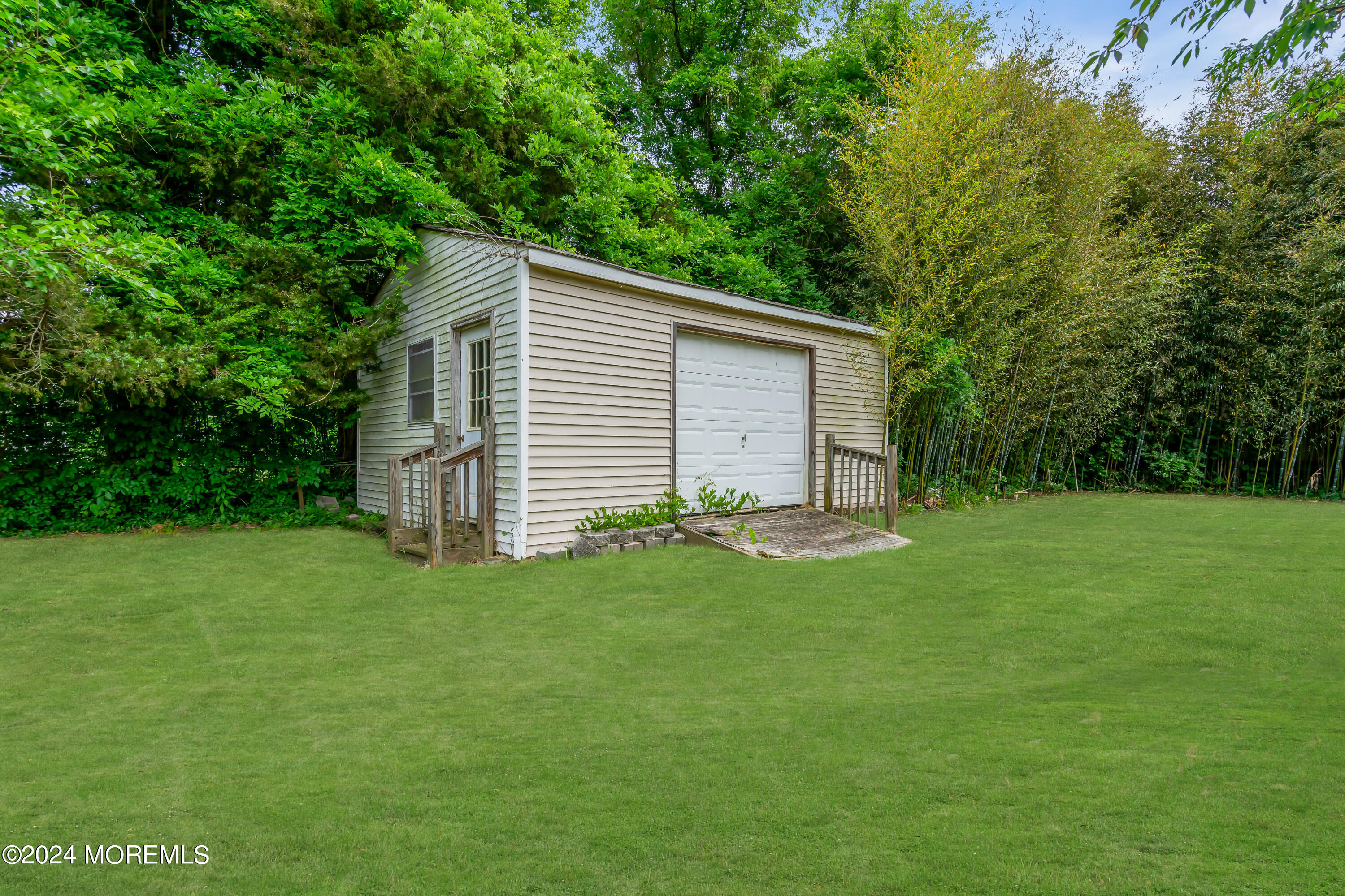 108 Jericho Road Tuckerton, NJ 08087 - Photo 24 of 24 a backyard of a house with plants and large tree