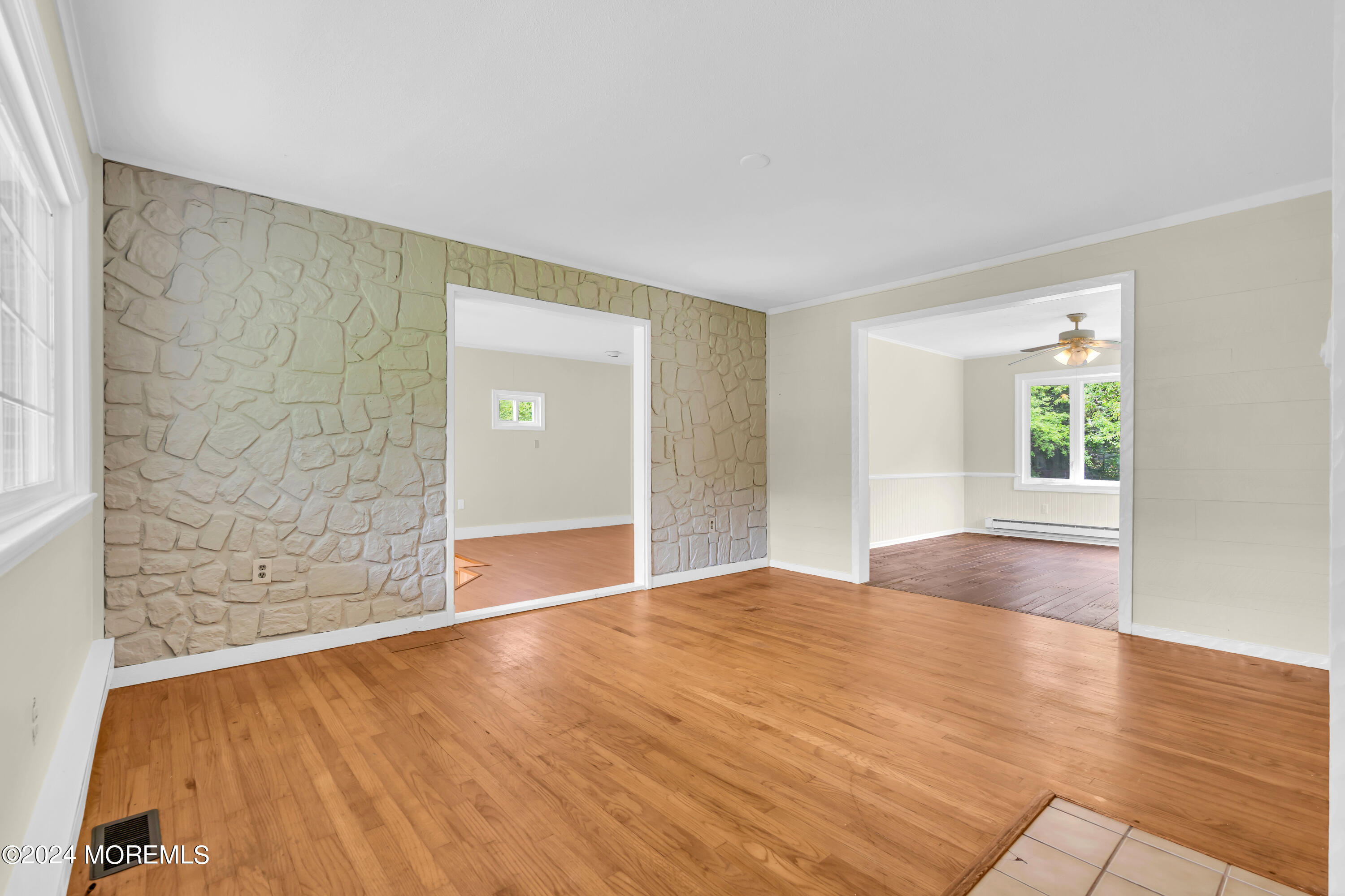 108 Jericho Road Tuckerton, NJ 08087 - Photo 4 of 24 a view of an empty room with wooden floor and a window