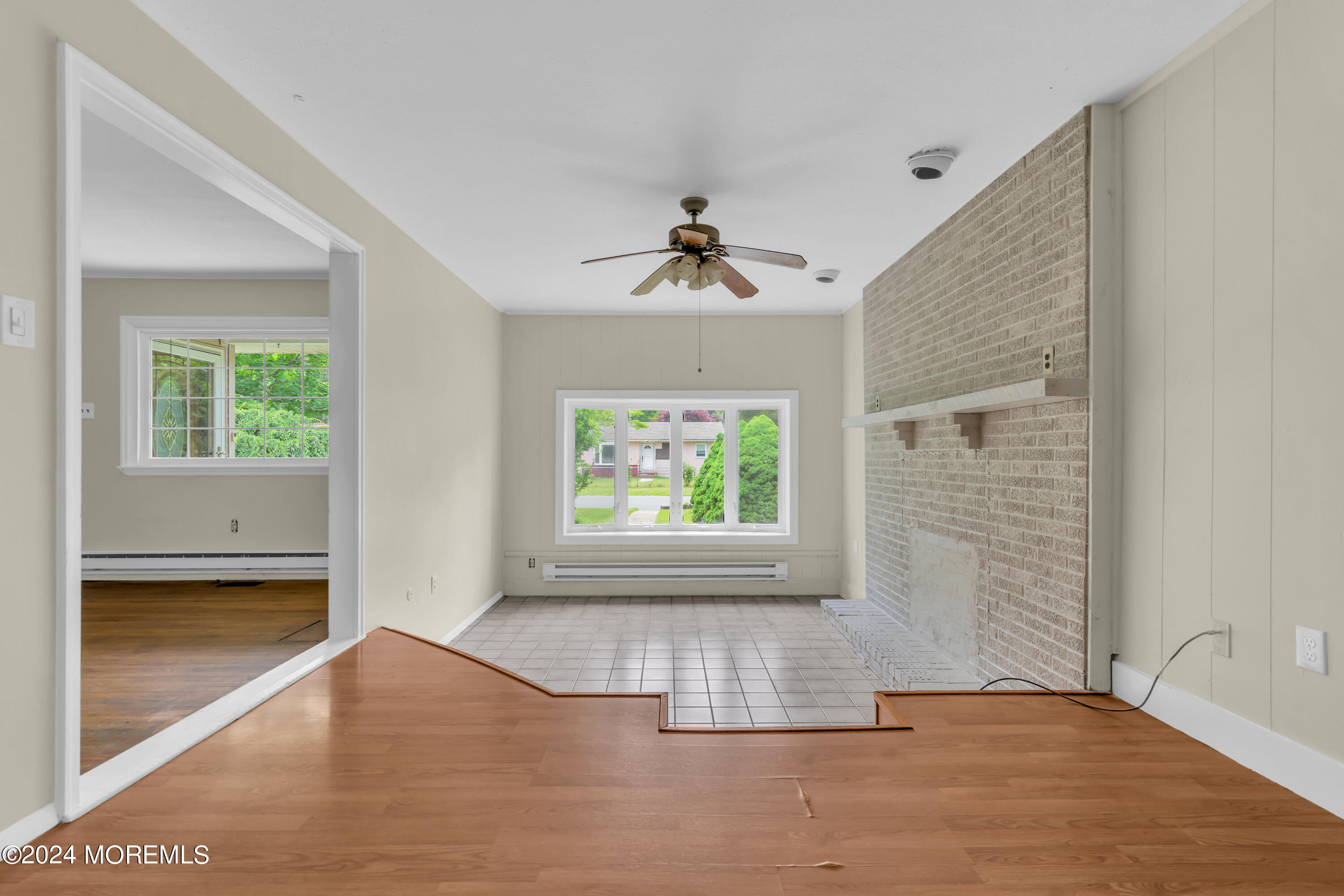 108 Jericho Road Tuckerton, NJ 08087 - Photo 6 of 24 wooden floor in an empty room with a window