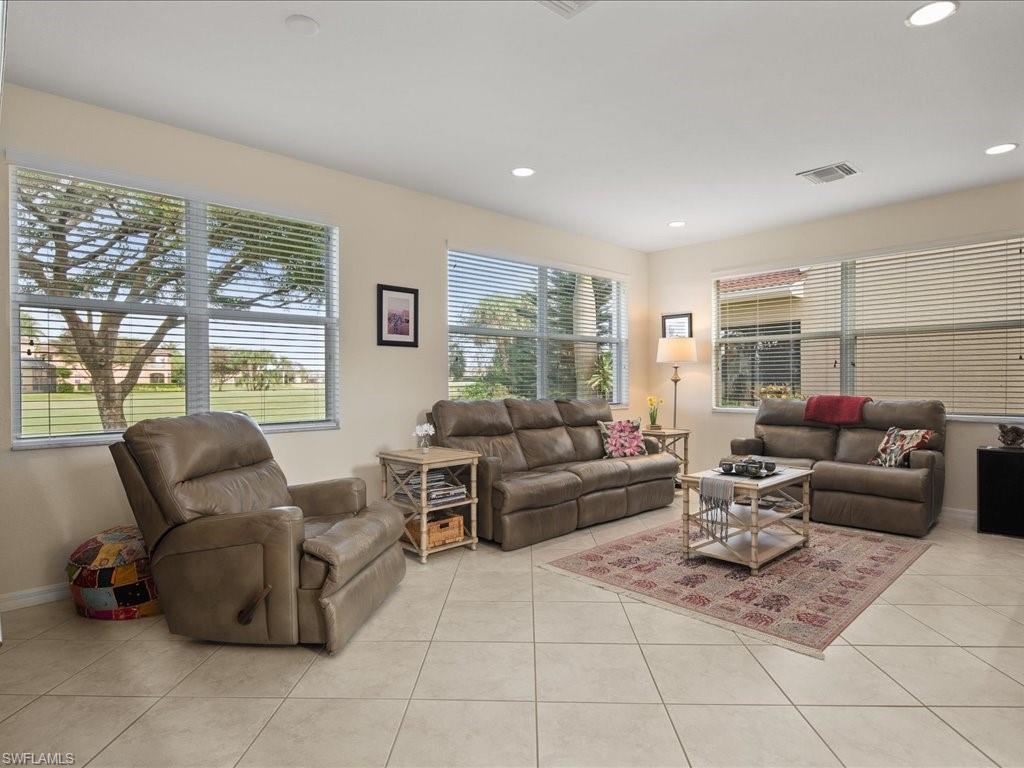 1646 Birdie Drive Naples, FL 34120 - Photo 6 of 37 Formal Living Room with lots of windows and natural light...