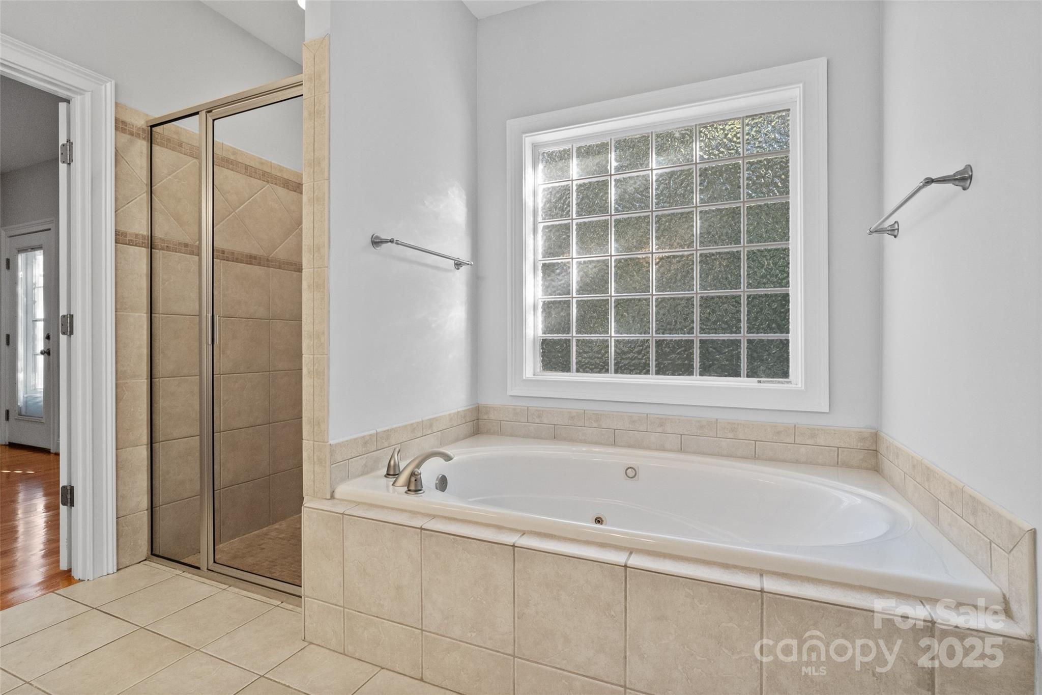 3310 Millstone Creek Road Lancaster, SC 29720 - Photo 22 of 45 a bathroom with a bathtub and a shower