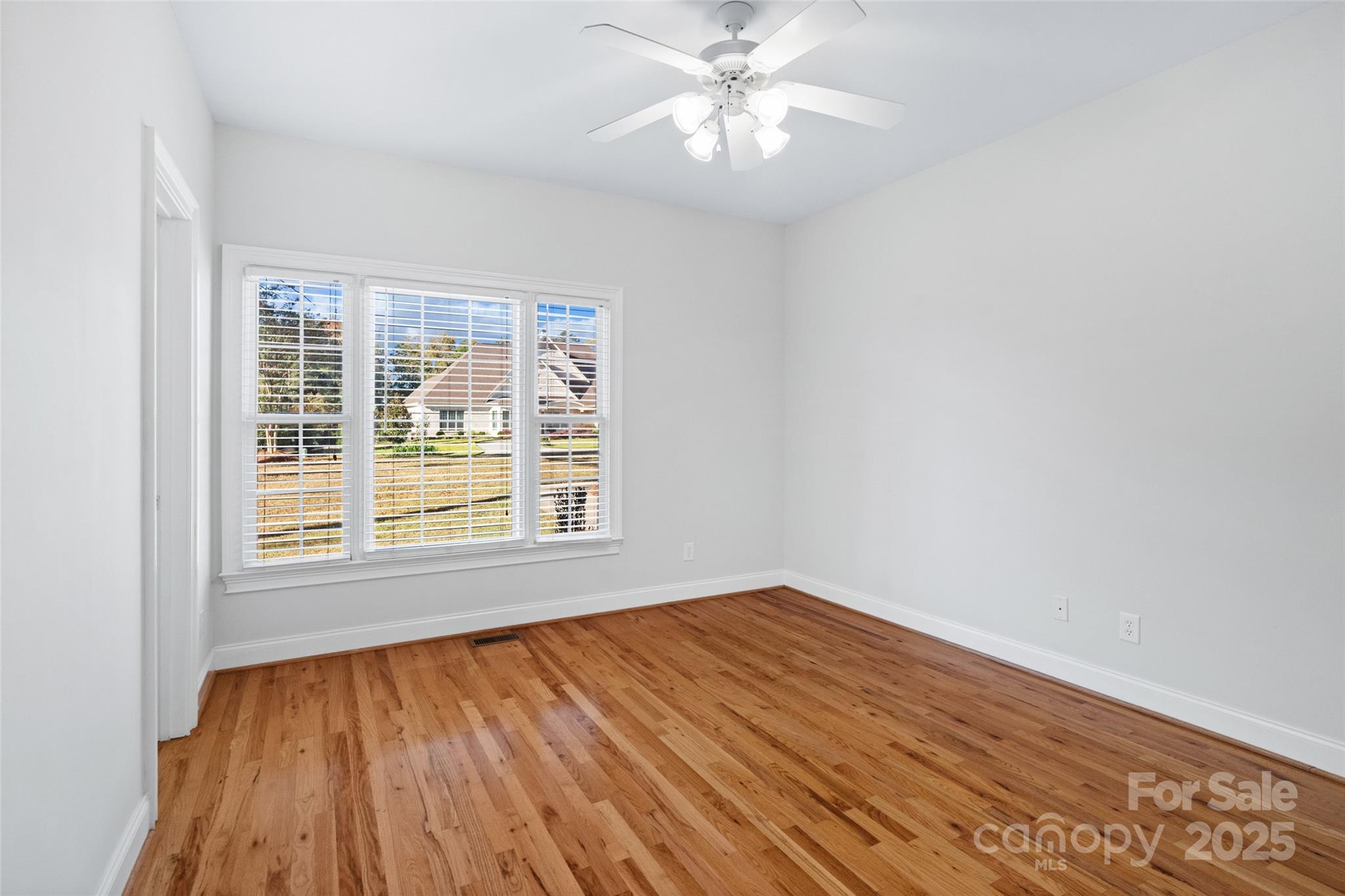 3310 Millstone Creek Road Lancaster, SC 29720 - Photo 24 of 45 a view of an empty room with wooden floor and a window