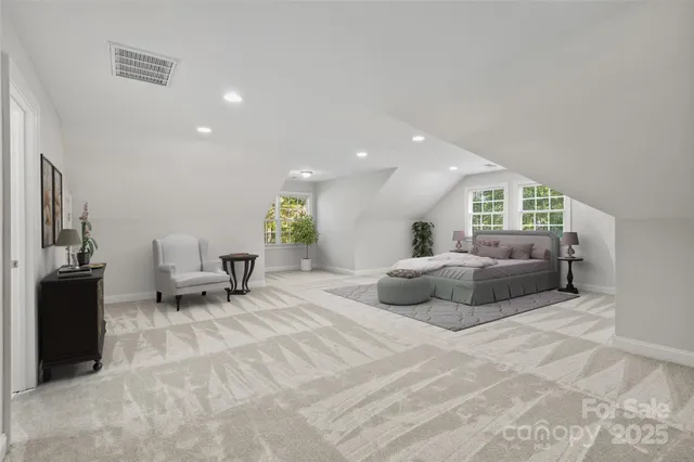 a bedroom with furniture and a bed