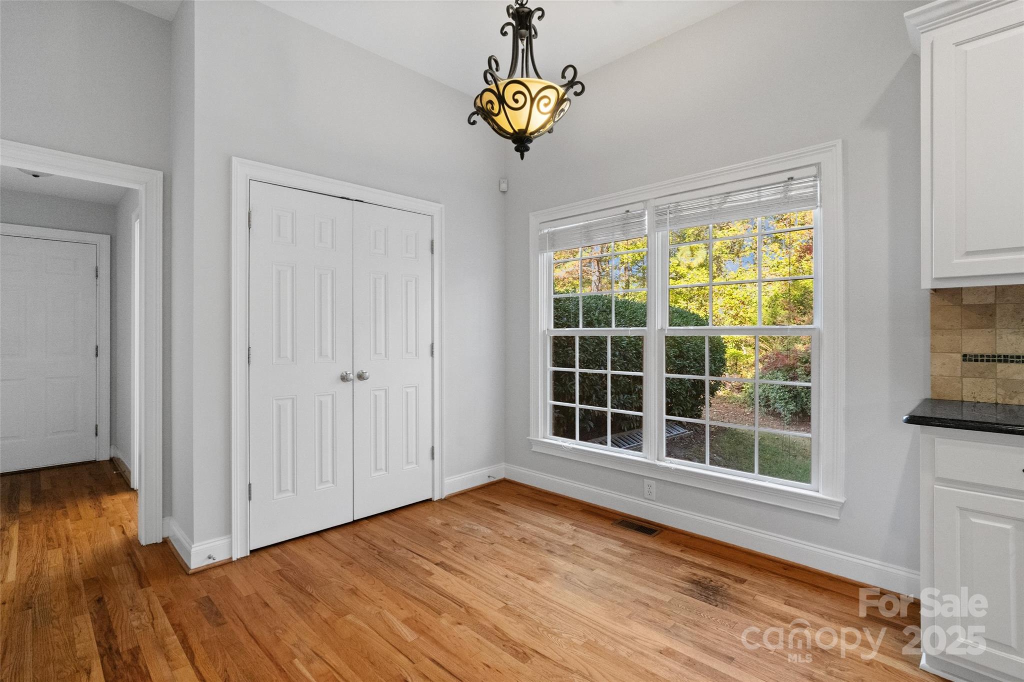 3310 Millstone Creek Road Lancaster, SC 29720 - Photo 8 of 45 a view of an empty room with a window and wooden floor