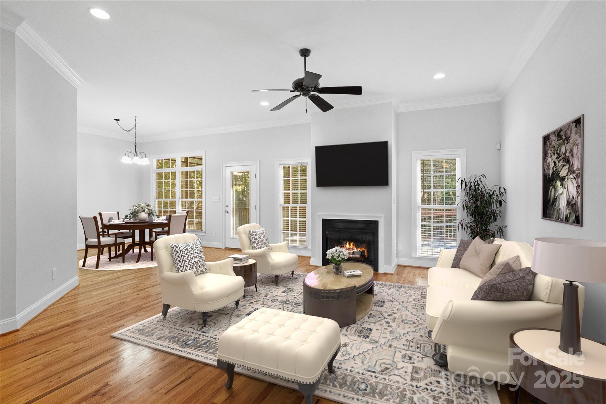 3310 Millstone Creek Road Lancaster, SC 29720 - Photo 9 of 45 a living room with furniture a fireplace and a flat screen tv