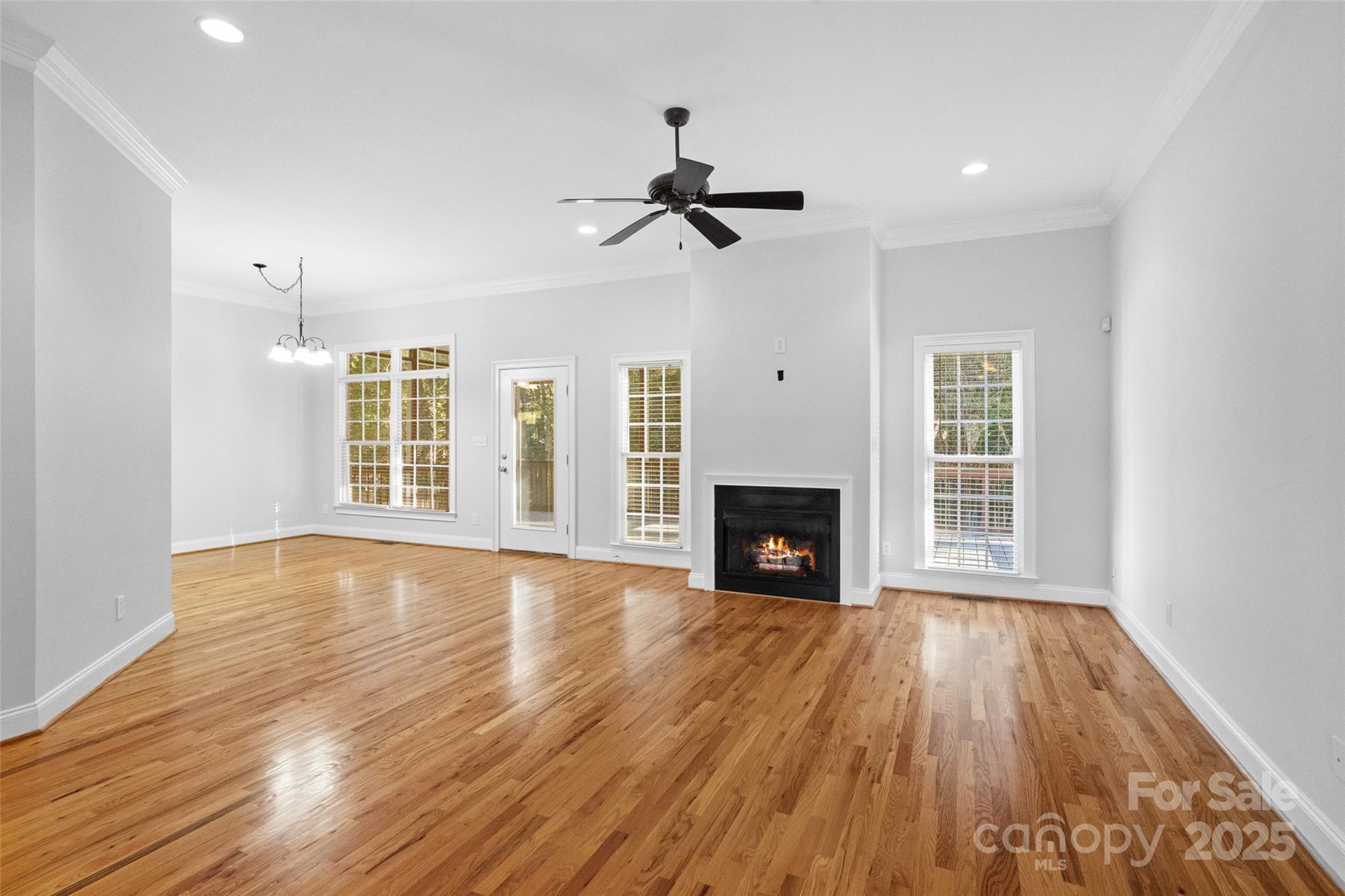 3310 Millstone Creek Road Lancaster, SC 29720 - Photo 10 of 45 a view of empty room with wooden floor and fireplace
