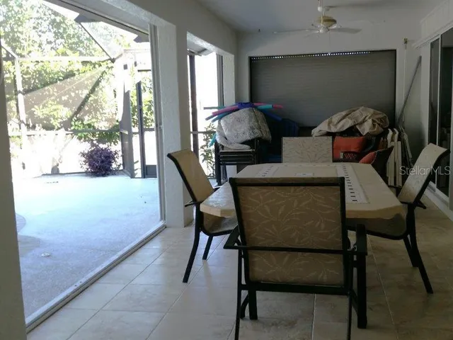 a view of a dining room with furniture and a window