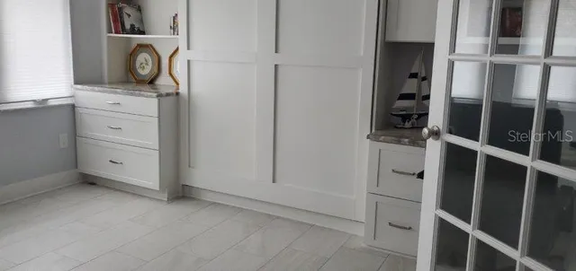 a view of cabinet and mirror