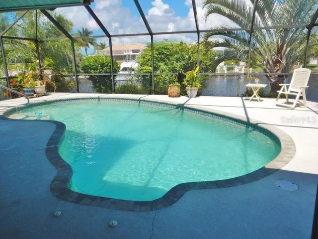 a view of a swimming pool with a porch