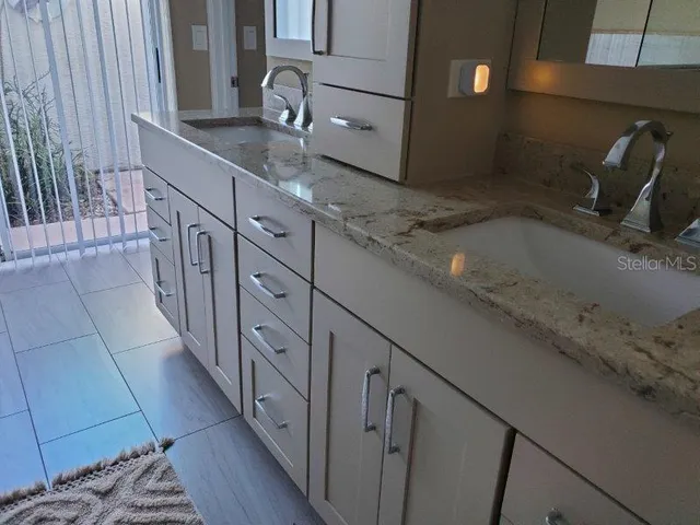a kitchen with granite countertop a sink and a granite counter tops
