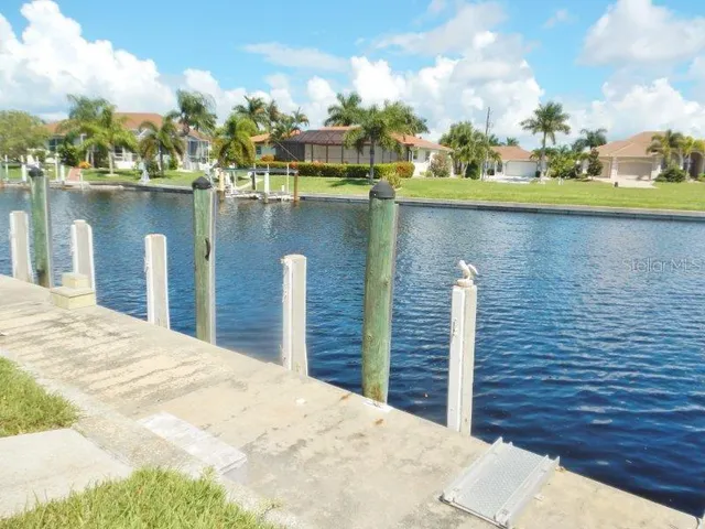a view of a lake with tall buildings