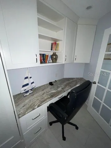 a living room with granite countertop furniture and a rug
