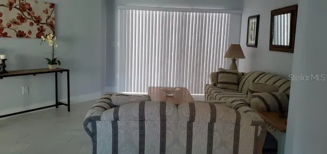 a view of a balcony with furniture