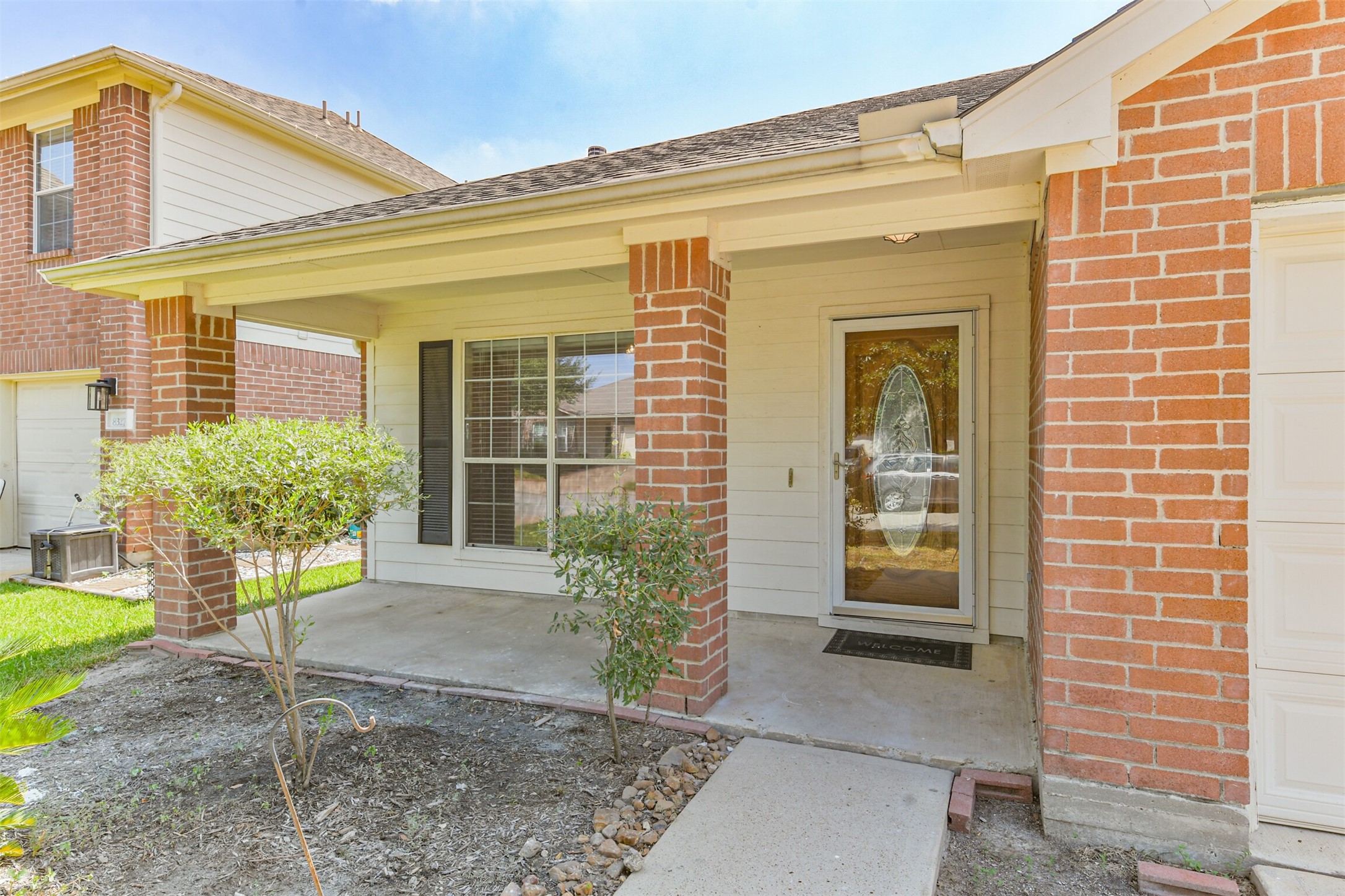 8331 Loetsch Ridge Way Spring, TX 77379 - Photo 6 of 31 The welcoming covered front porch provides the perfect spot to begin your day with a cup of morning coffee or relax and unwind at the end of the evening.