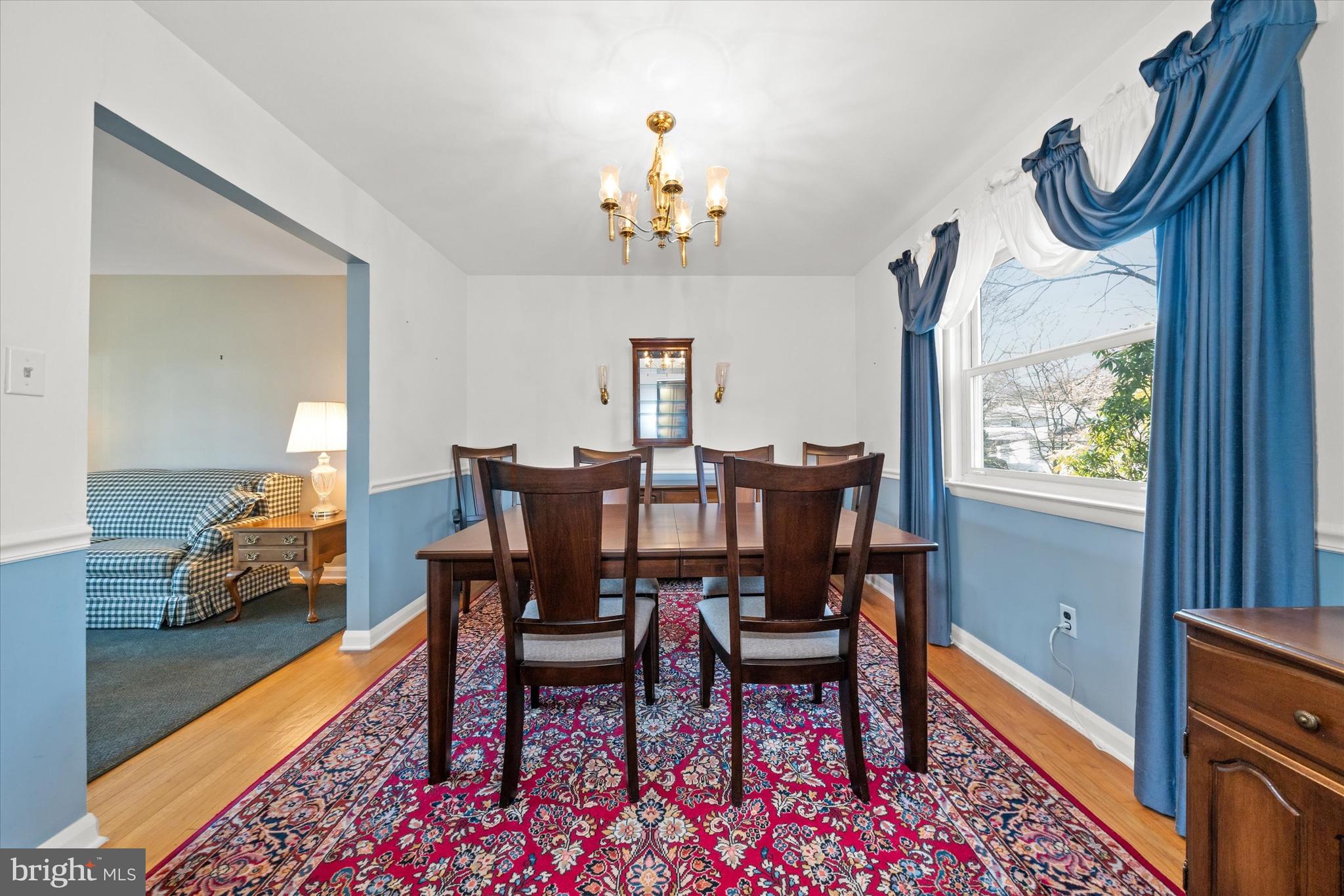2605 Cayuga Road Wilmington, DE 19810 - Photo 12 of 53 a view of a dining room with furniture and a chandelier