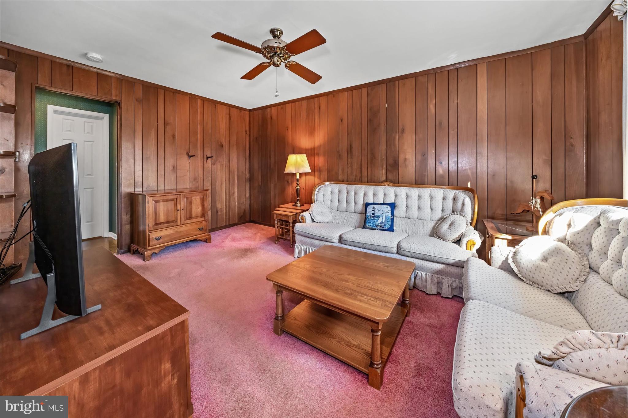 2605 Cayuga Road Wilmington, DE 19810 - Photo 23 of 53 a living room with furniture a window and a flat screen tv