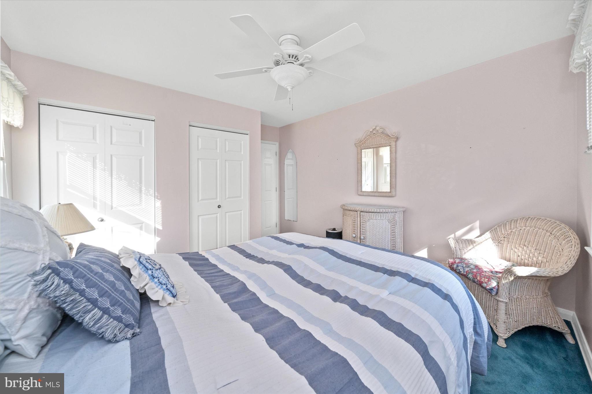 2605 Cayuga Road Wilmington, DE 19810 - Photo 33 of 53 a bedroom with a bed and a chandelier