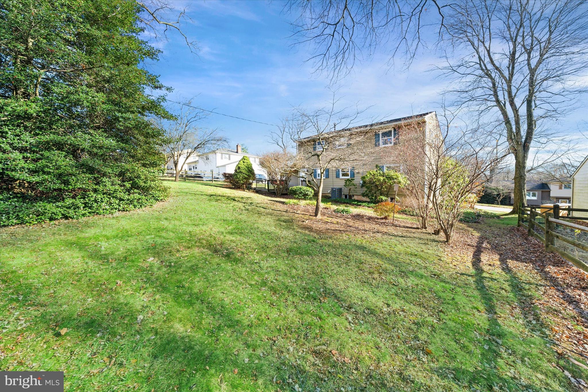 2605 Cayuga Road Wilmington, DE 19810 - Photo 51 of 53 a view of a yard with plants and a bench