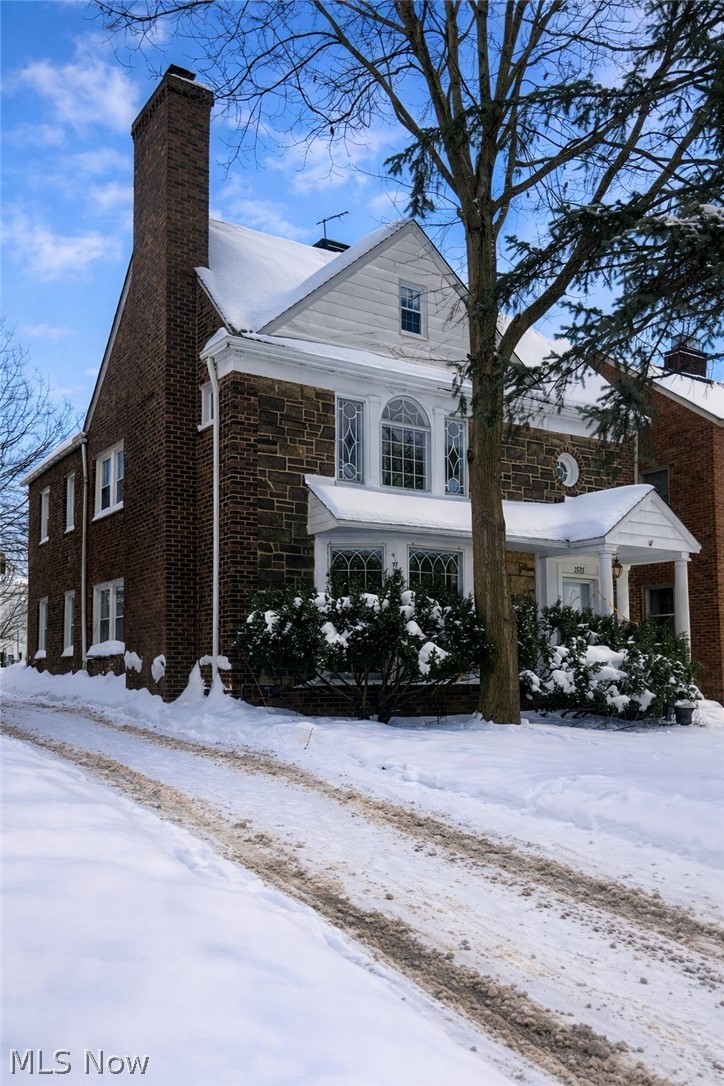 3575 Gridley Road Shaker Heights, OH 44122 - Photo 3 of 47 Snow covered property with a chimney and brick siding