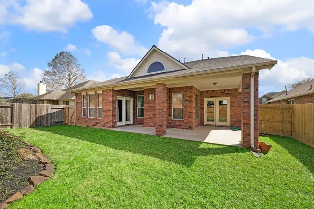 a front view of a house with a yard and porch