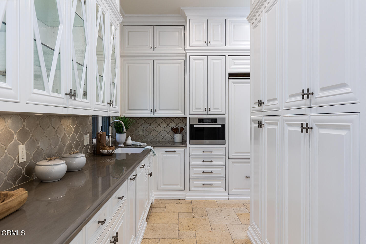 1610 Kinneloa Mesa Road Pasadena, CA 91107 - Photo 21 of 72 a kitchen with stainless steel appliances white cabinets and a sink