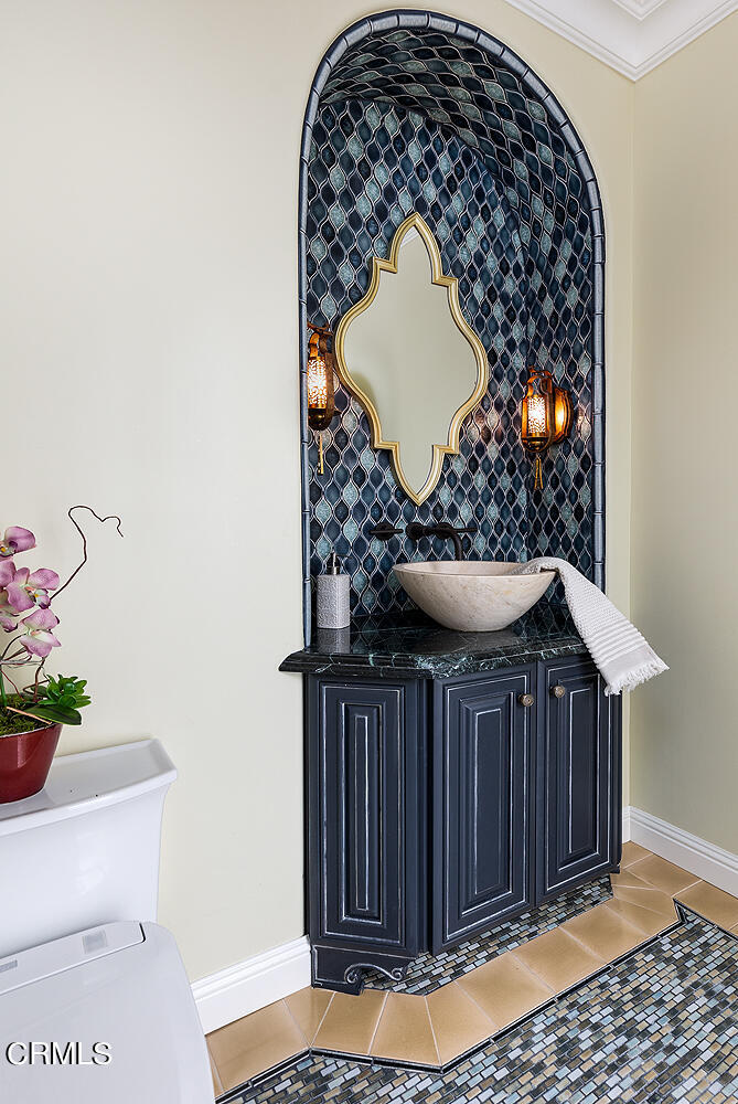 1610 Kinneloa Mesa Road Pasadena, CA 91107 - Photo 25 of 72 a bathroom with a sink and a mirror