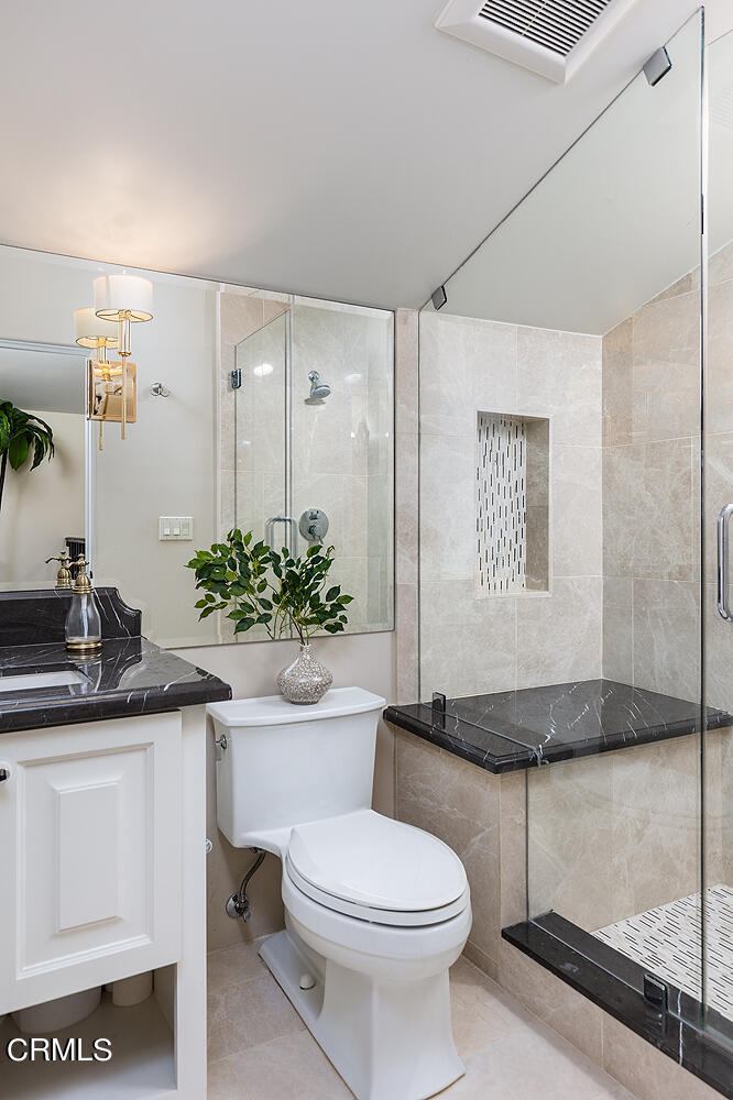 1610 Kinneloa Mesa Road Pasadena, CA 91107 - Photo 52 of 72 a bathroom with a sink a toilet and shower