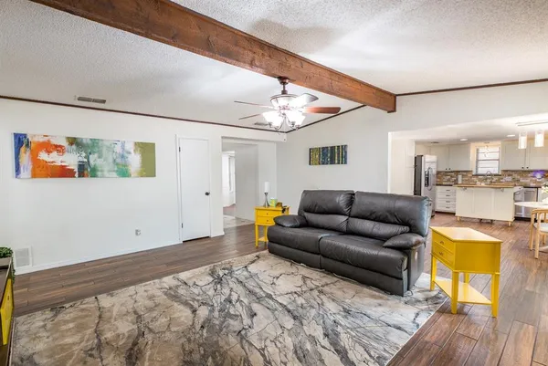 a living room with furniture and a table