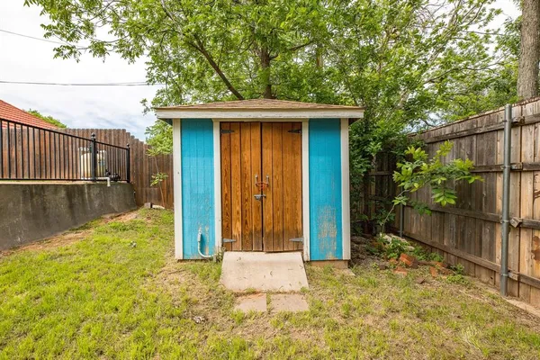 a view of backyard with cabin