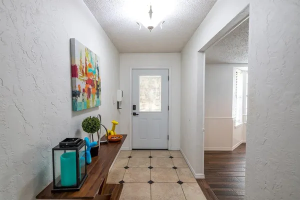 a hallway with wooden floor