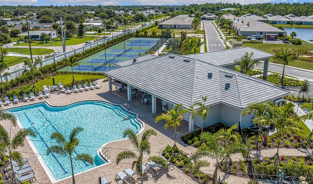 1067 Enbrook Loop Naples, FL 34114 - Photo 13 of 15 an aerial view of a house with a swimming pool and outdoor seating