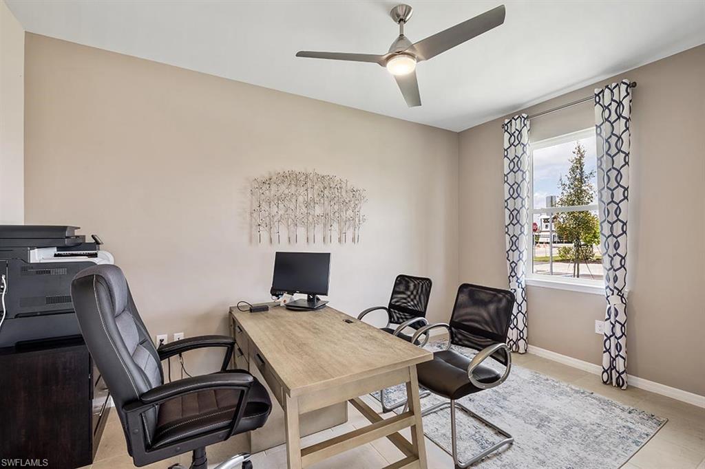 1067 Enbrook Loop Naples, FL 34114 - Photo 5 of 15 a view of a workspace with furniture and a window