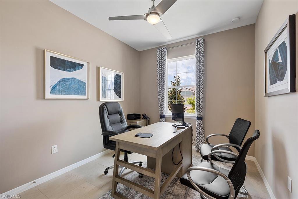 1067 Enbrook Loop Naples, FL 34114 - Photo 6 of 15 a view of a workspace with furniture and a window