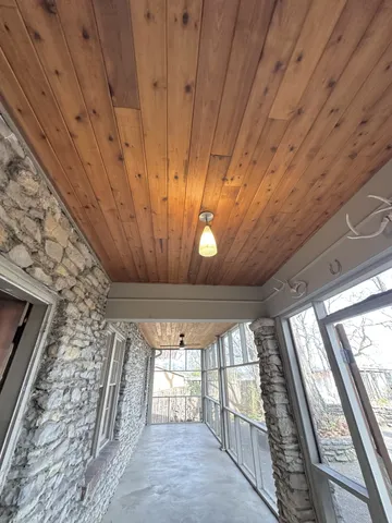 a view of a livingroom with wooden floor