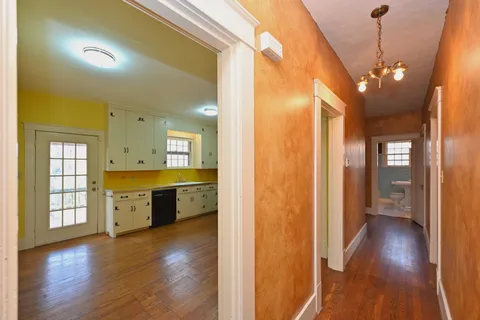 a bathroom with a sink a mirror and a window