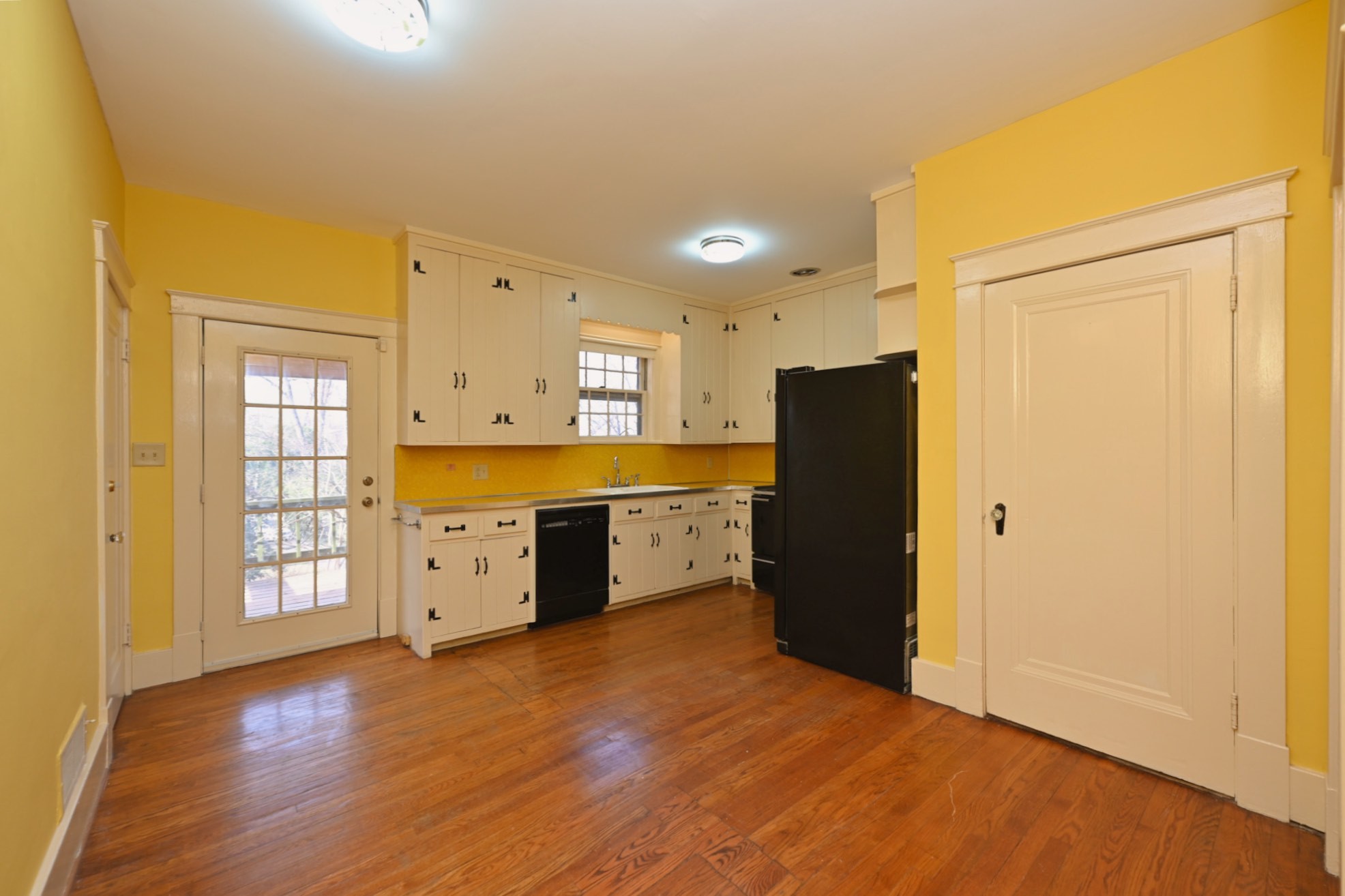 4228 Brush Hill Road Nashville, TN 37216 - Photo 24 of 100 a large kitchen with a wooden floor and a refrigerator