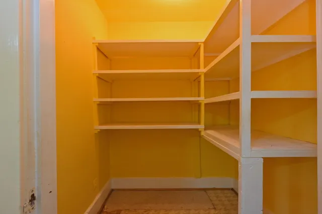 a bathroom with a tub a sink and mirrors