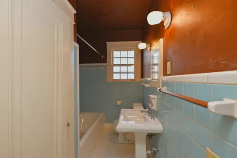 a view of a room with lots of wooden furniture