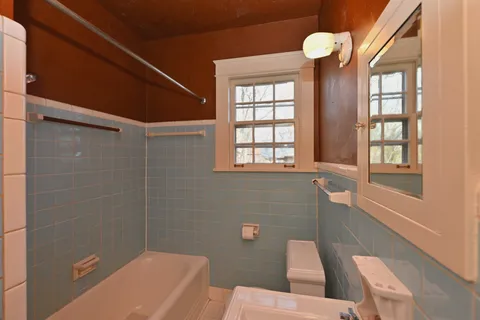 a view of a room with lots of wooden furniture