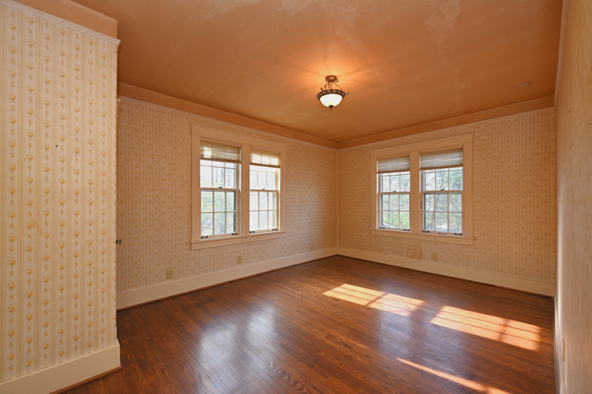 4228 Brush Hill Road Nashville, TN 37216 - Photo 39 of 100 a view of an empty room with wooden floor and a window