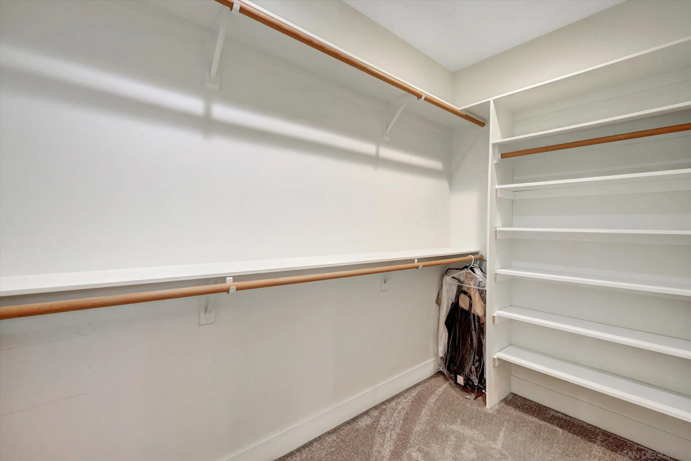 11611 Rancho Heights Road Pala, CA 92059 - Photo 14 of 43 a view of walk in closet with empty racks