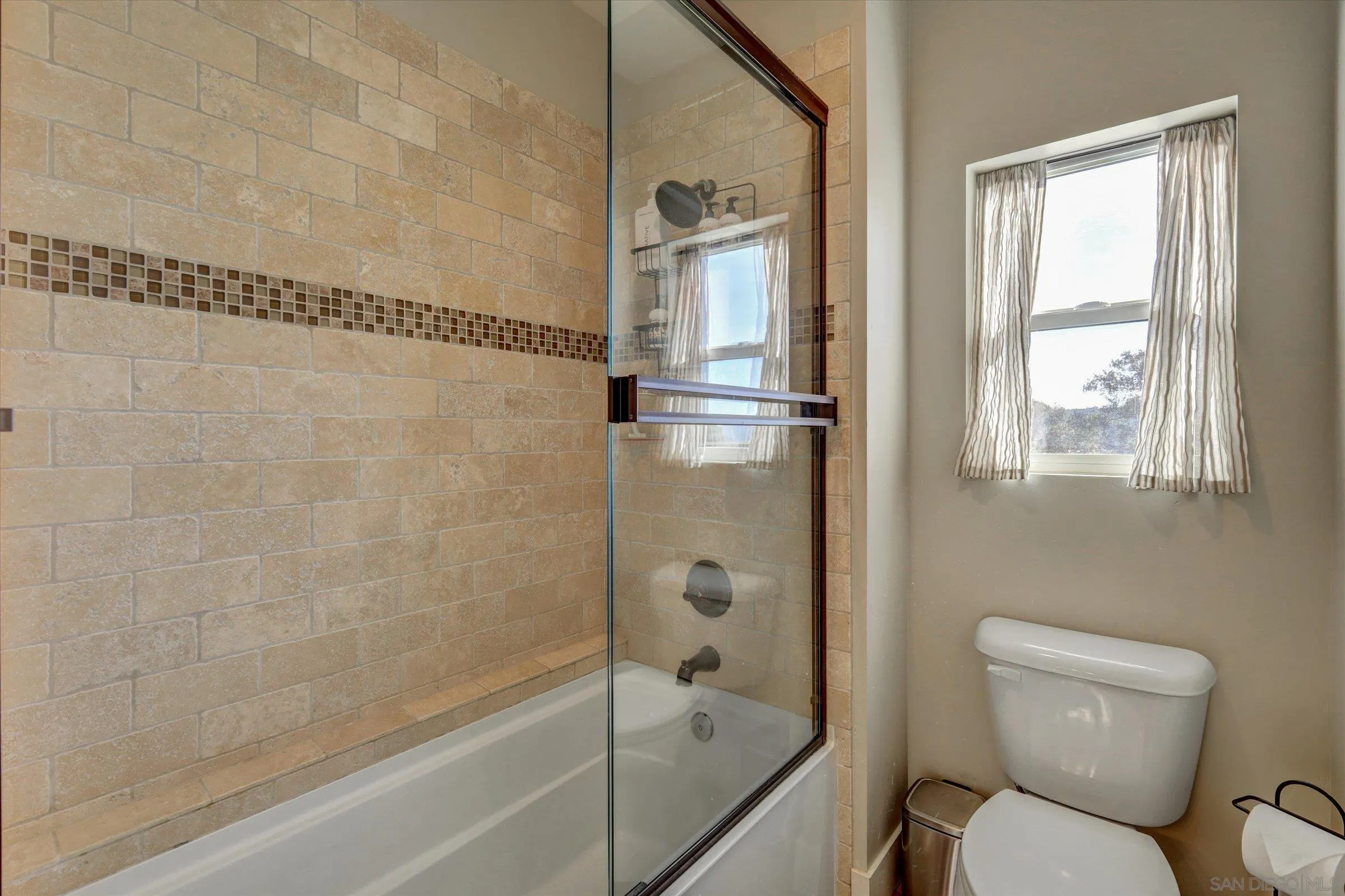 11611 Rancho Heights Road Pala, CA 92059 - Photo 19 of 43 a bathroom with a toilet and shower