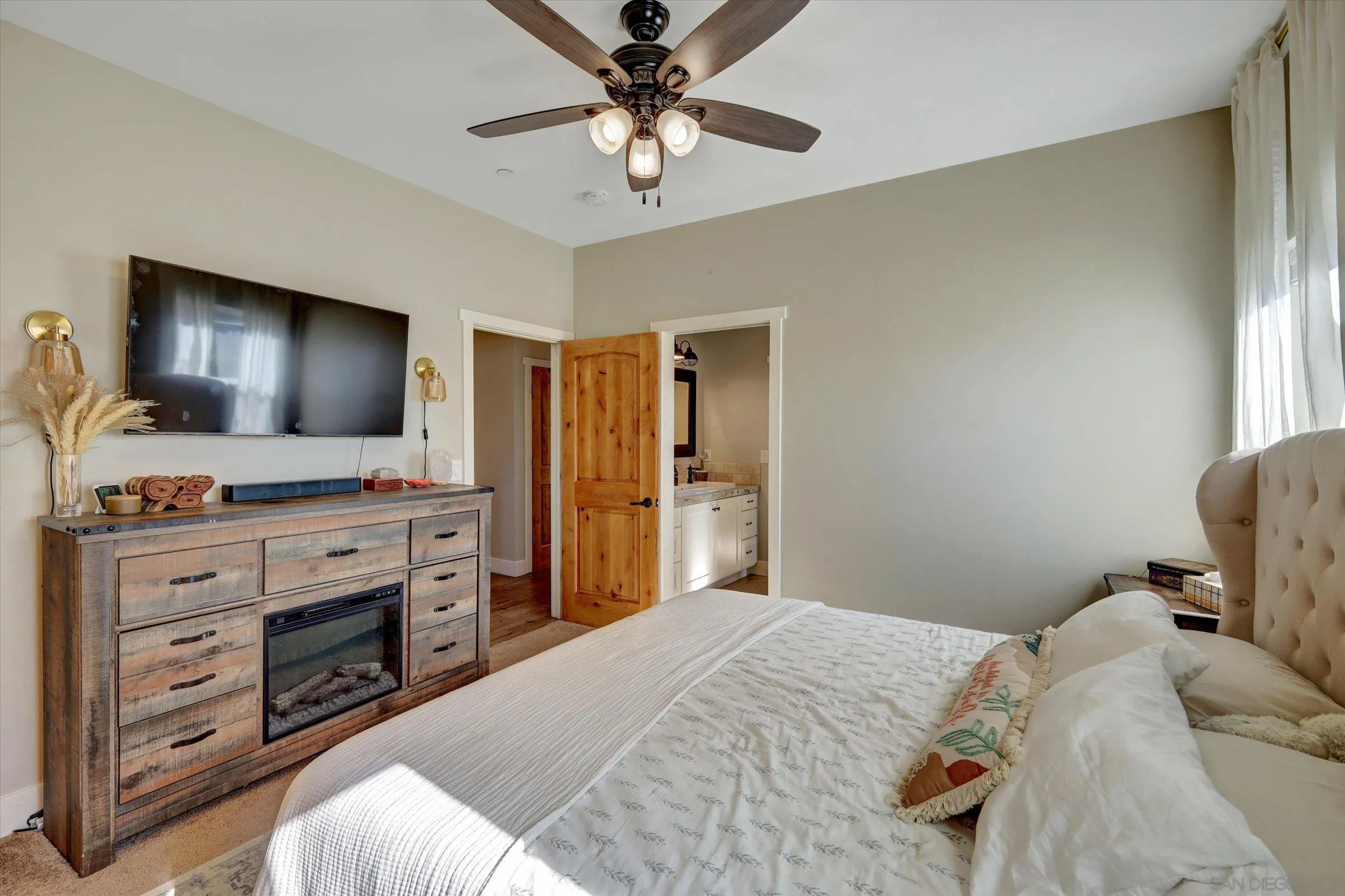 11611 Rancho Heights Road Pala, CA 92059 - Photo 20 of 43 a bedroom with a bed and a flat screen tv