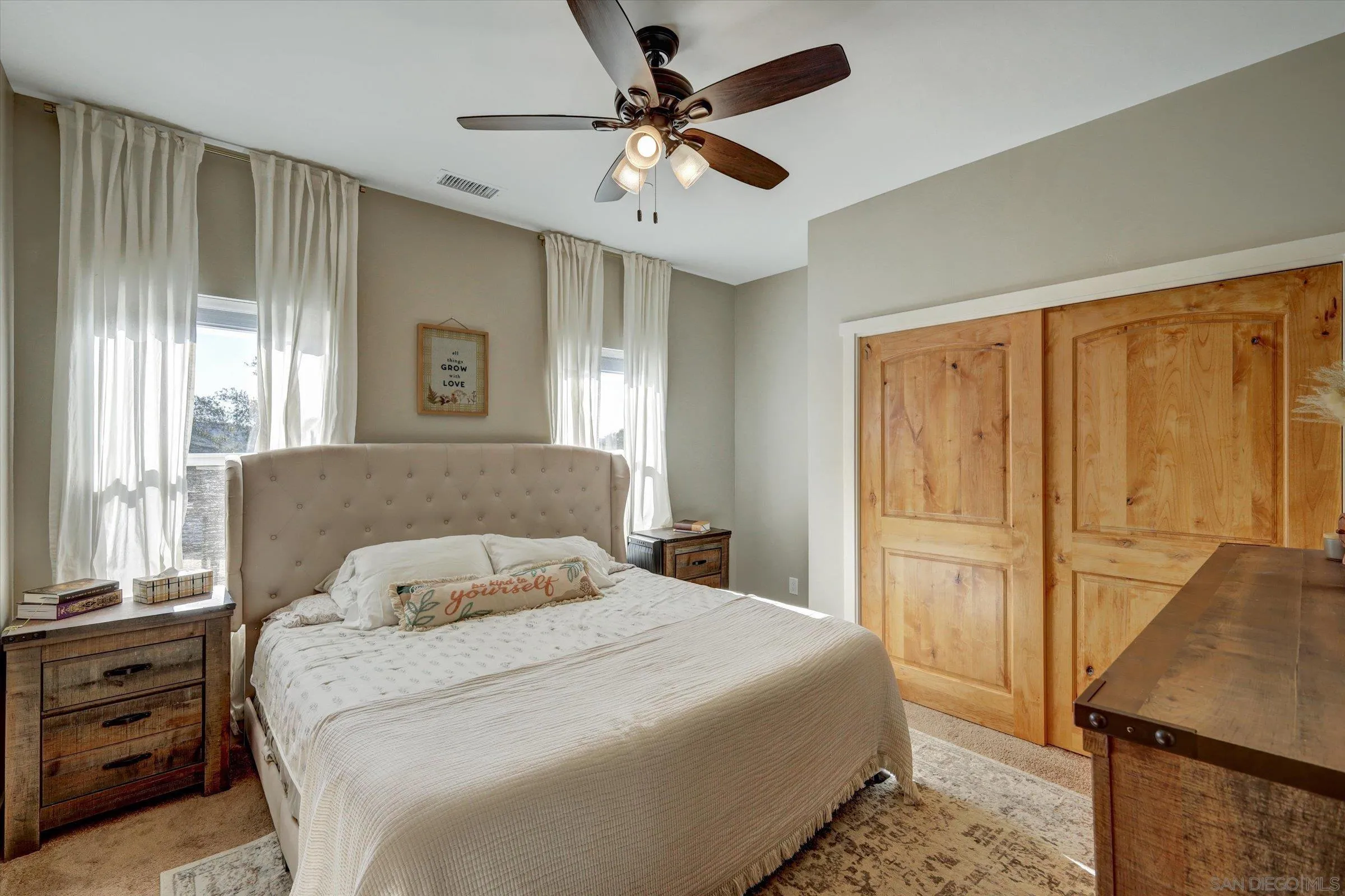 11611 Rancho Heights Road Pala, CA 92059 - Photo 21 of 43 a bedroom with a bed dresser and a window