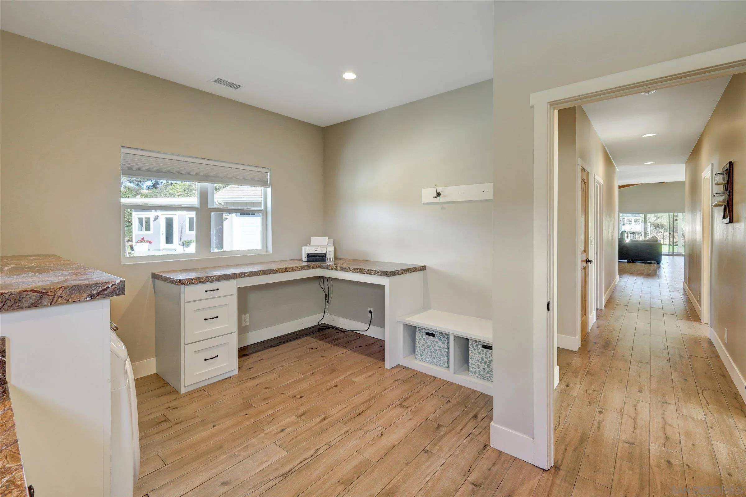 11611 Rancho Heights Road Pala, CA 92059 - Photo 23 of 43 a kitchen with a wooden floor and a window